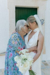 Cinematic wedding photographer UK capturing an emotional moment between bride and family member