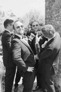 groomsmen all laughing candidly at a wedding at Bignor Park